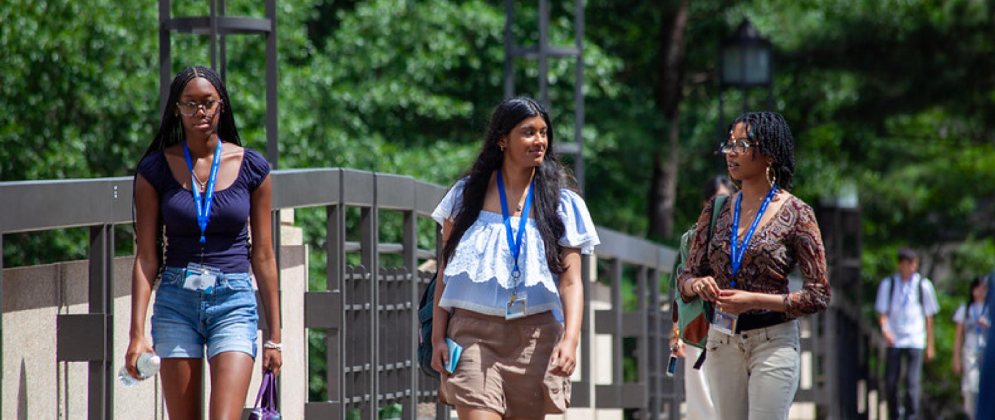 students on bridge walking to class